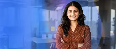 Confident woman standing in modern office – Hays Japan client interviews and recruitment services.